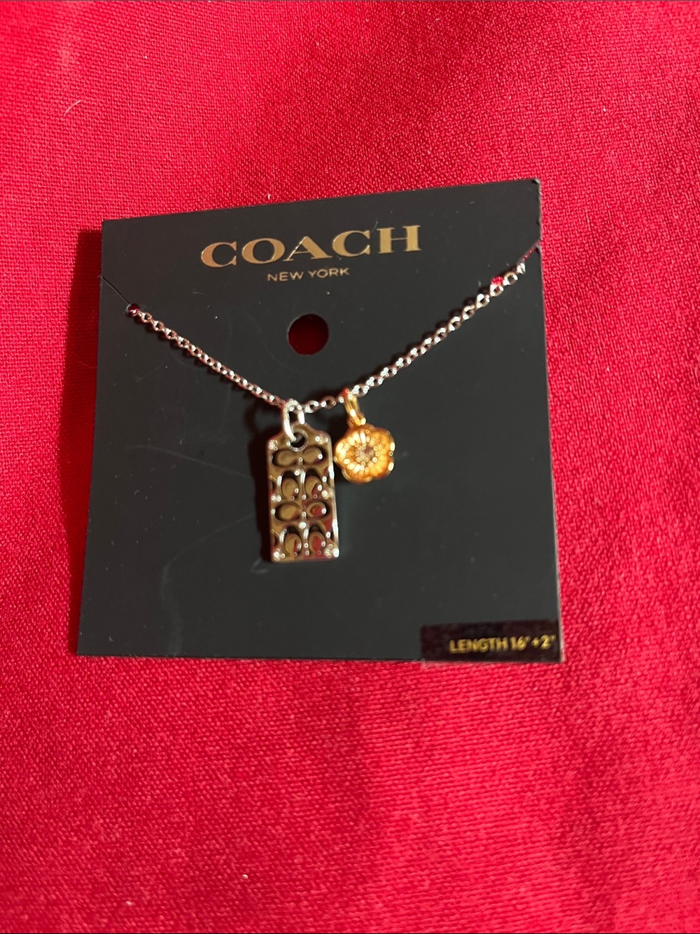 COACH Two-Tone Signature Pendant Necklace in Gold and Silver